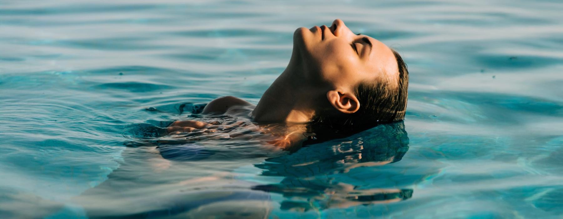 a man and a woman swimming in water